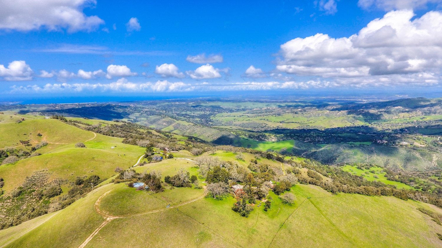 A house under construction, still framed in timber in Carmel — Selling Carmel Valley Ranches